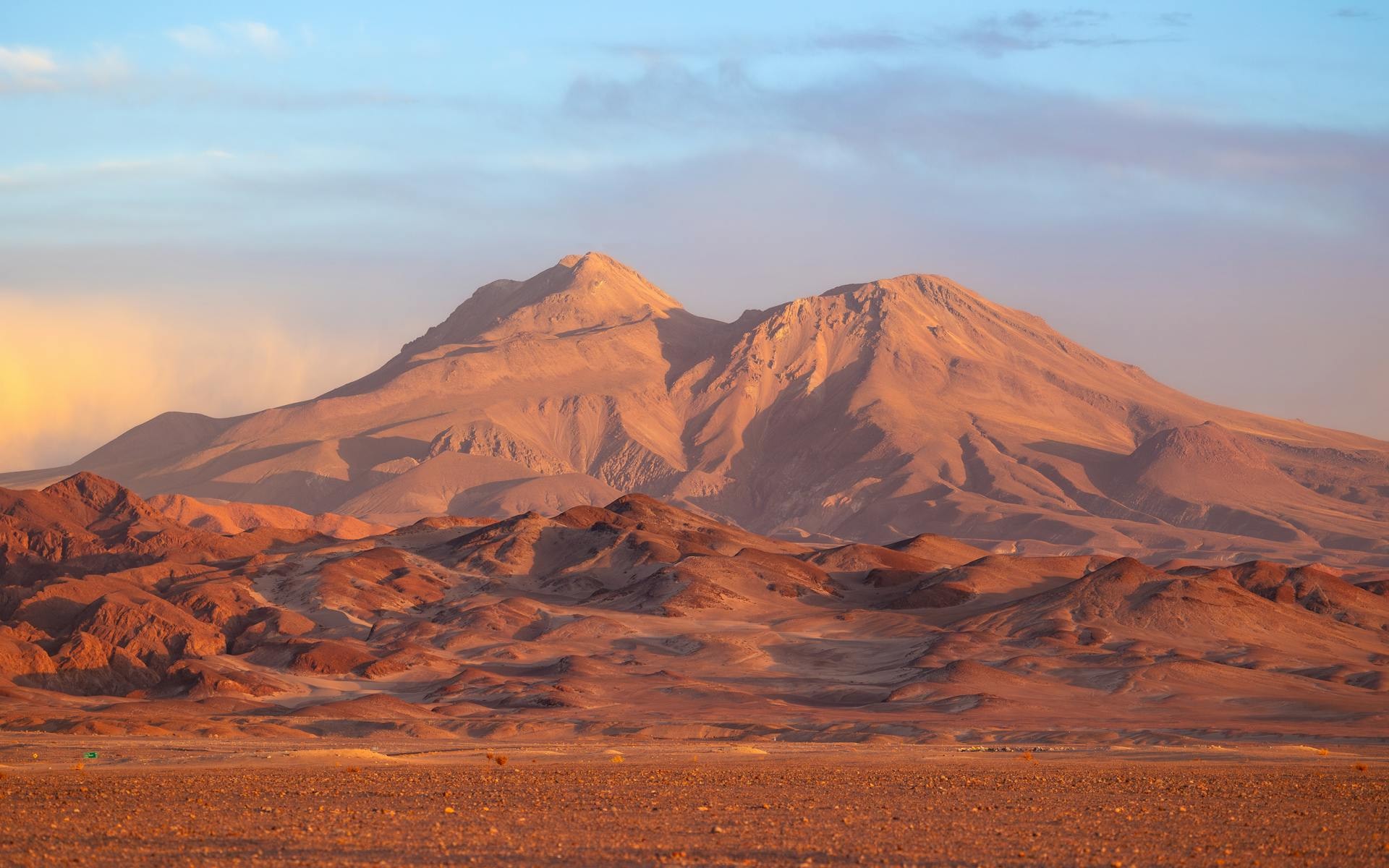 El Tatio geysers steaming at sunrise above the high Andean altiplano near San Pedro de Atacama