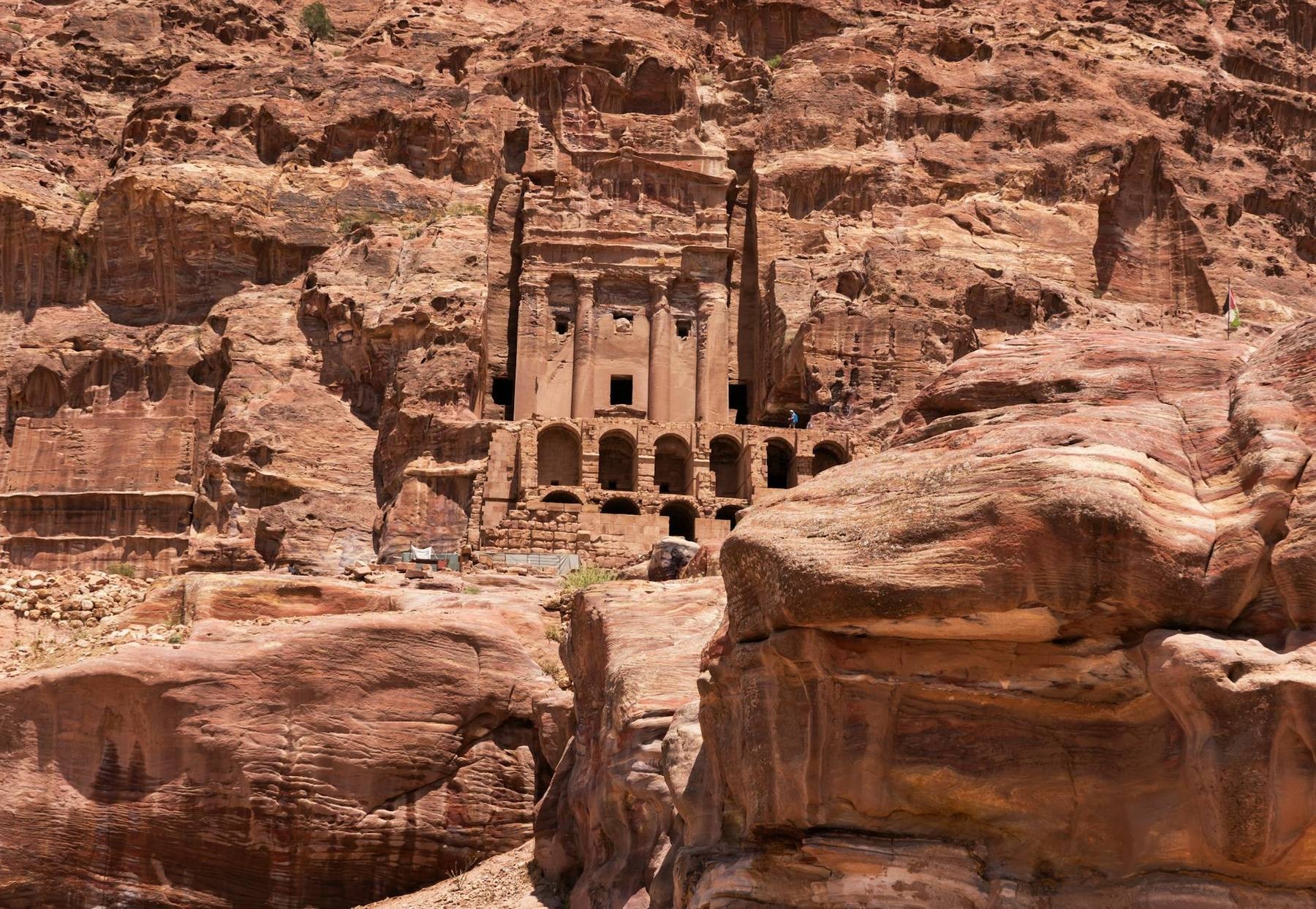 The Treasury (Al-Khazneh) at the end of the Siq in Petra, framed by the towering sandstone walls of the gorge