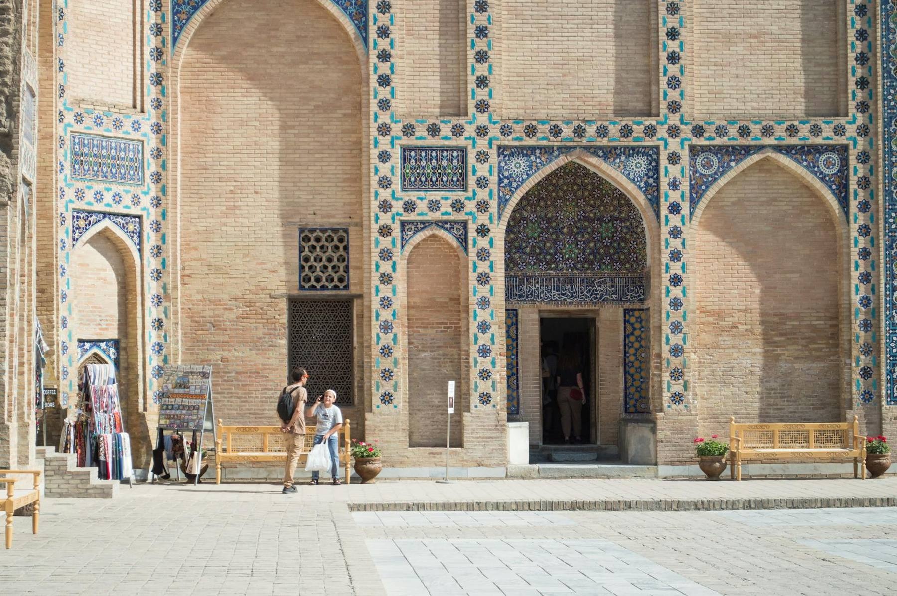 The Registan in Samarkand at golden hour, three tiled madrasas framing the open square along Uzbekistan's Silk Road circuit