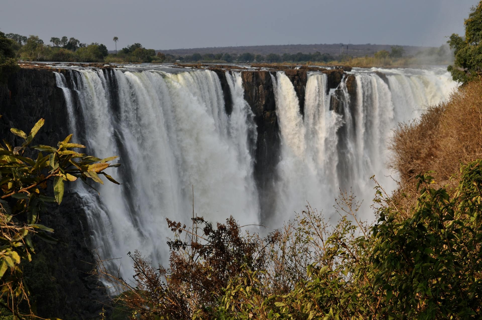 Victoria Falls thundering at the Zimbabwe and Zambia border with the Zambezi River cutting through the Southern African plateau